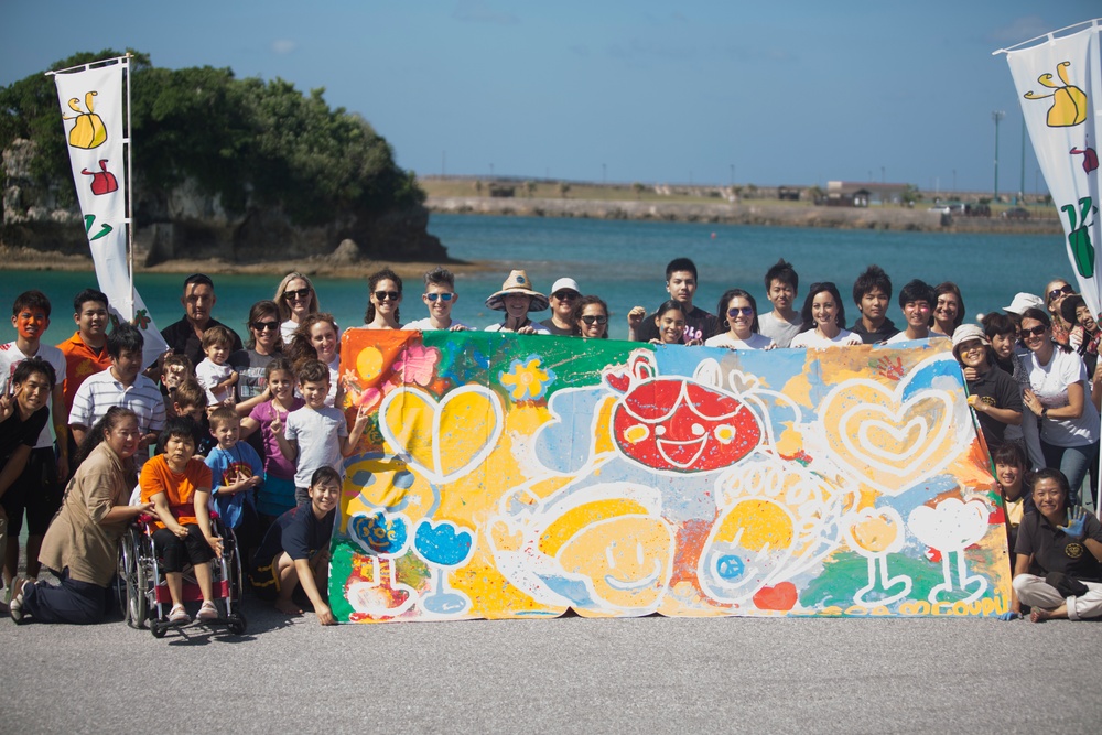 Local and military communities come together to create art banner