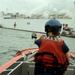 Coast Guard crewmembers escort the USNS Comfort into San Juan, Puerto Rico