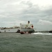 Coast Guard crewmembers escort the USNS Comfort into San Juan, Puerto Rico