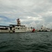 Coast Guard crewmembers escort the USNS Comfort into San Juan, Puerto Rico