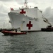 Coast Guard crewmembers escort the USNS Comfort into San Juan, Puerto Rico