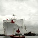 Coast Guard crewmembers escort the USNS Comfort into San Juan, Puerto Rico