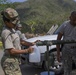Soldiers Fill Water Containers for Resident