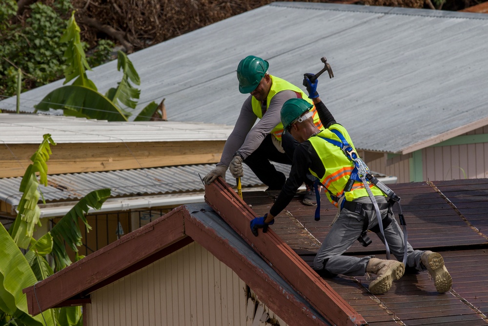 Contractors Remove Damaged Roofing