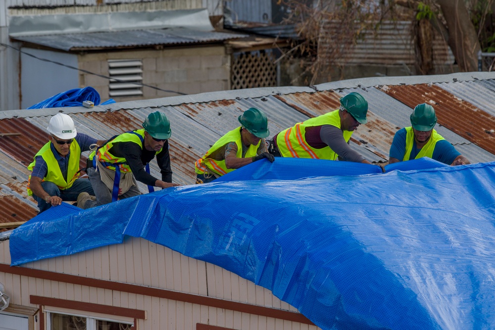 Contractors Install Blue Roof