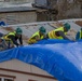 Contractors Install Blue Roof