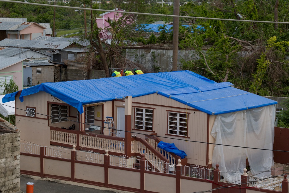 Contractors Install Blue Roof