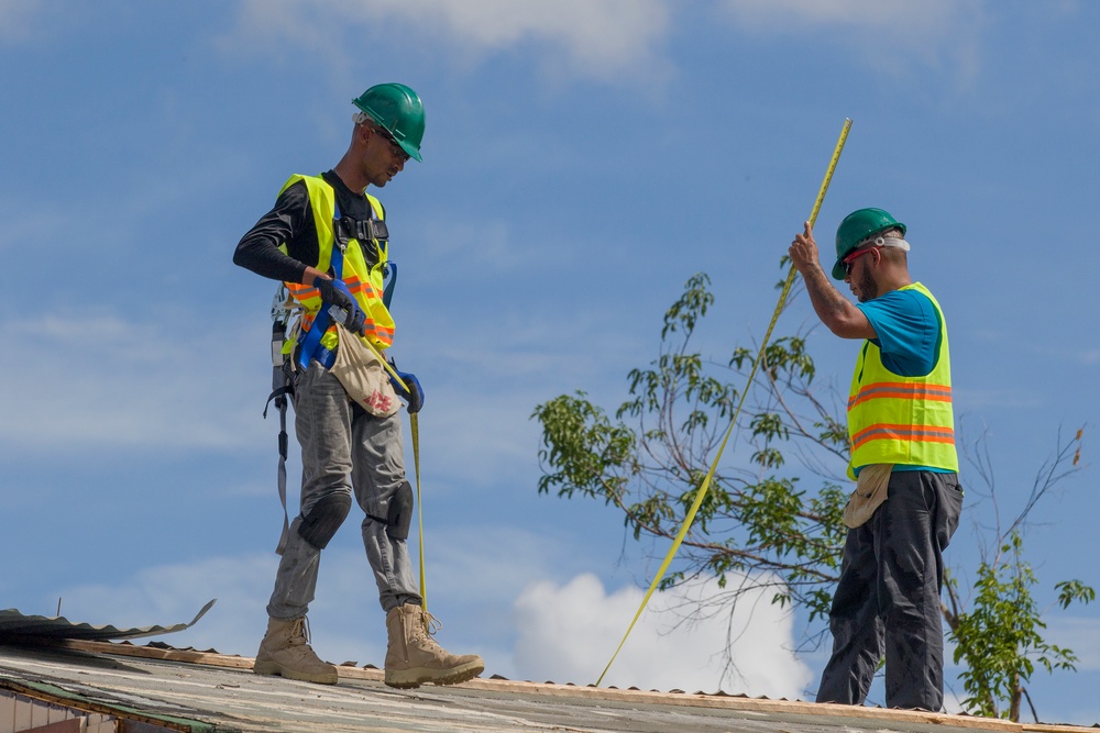 Contractors Measure Roof