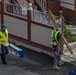 Contractors Carry Equipment