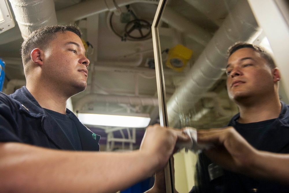 USS America Sailor cleans berthing