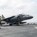 USS America Sailors salutes aircraft before lift off