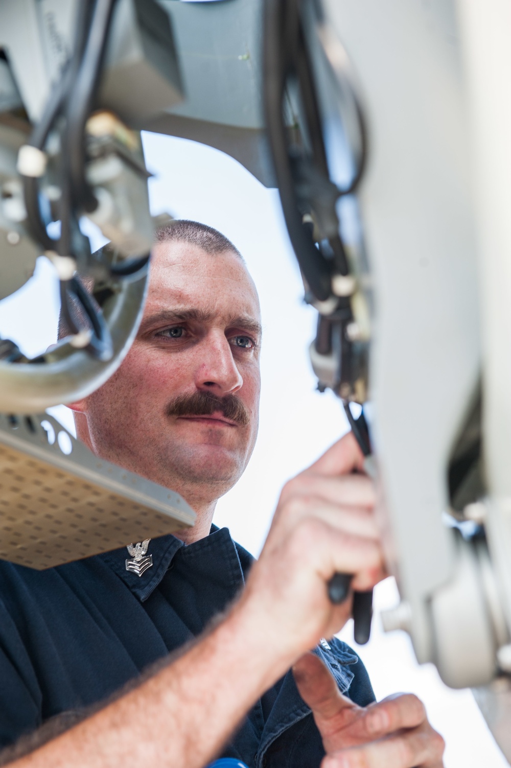 America Sailor conducts maintenance on CIWS