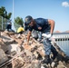 USS Bonhomme Richard (LHD 6) Sailors participate in base waterfront clean up