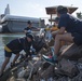USS Bonhomme Richard (LHD 6) Sailors participate in base waterfront clean up