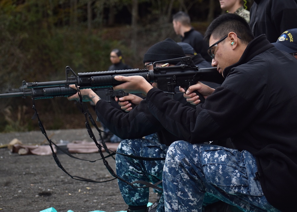 USS Blue Ridge Sailors shoot for the M16 and M500 gun qualifications at Combined Arms Training Center, Camp Fuji.