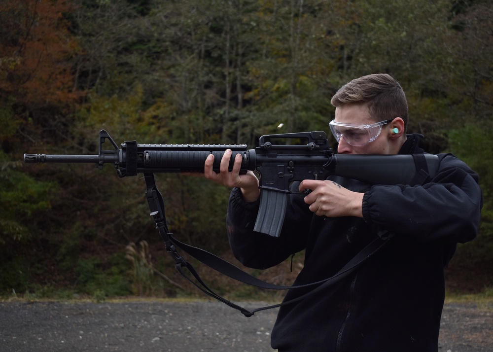 USS Blue Ridge Sailors shoot for the M16 and M500 gun qualifications at Combined Arms Training Center, Camp Fuji.