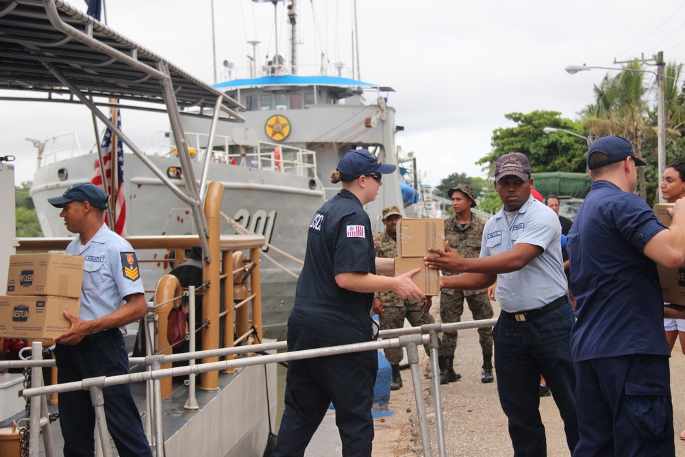 Coast Guard, Dominican navy onload food donation for Hurricane Maria victims