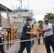 Coast Guard, Dominican navy onload food donation for Hurricane Maria victims