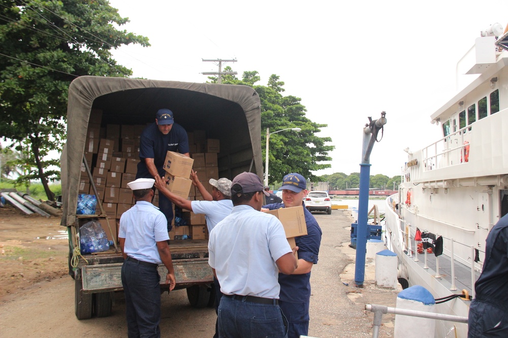 Coast Guard, Dominican navy onload food donation for Hurricane Maria victims