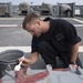 USS Lake Erie (CG 70) Seaman paints a scuttle