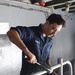 Sailor Paints Railing