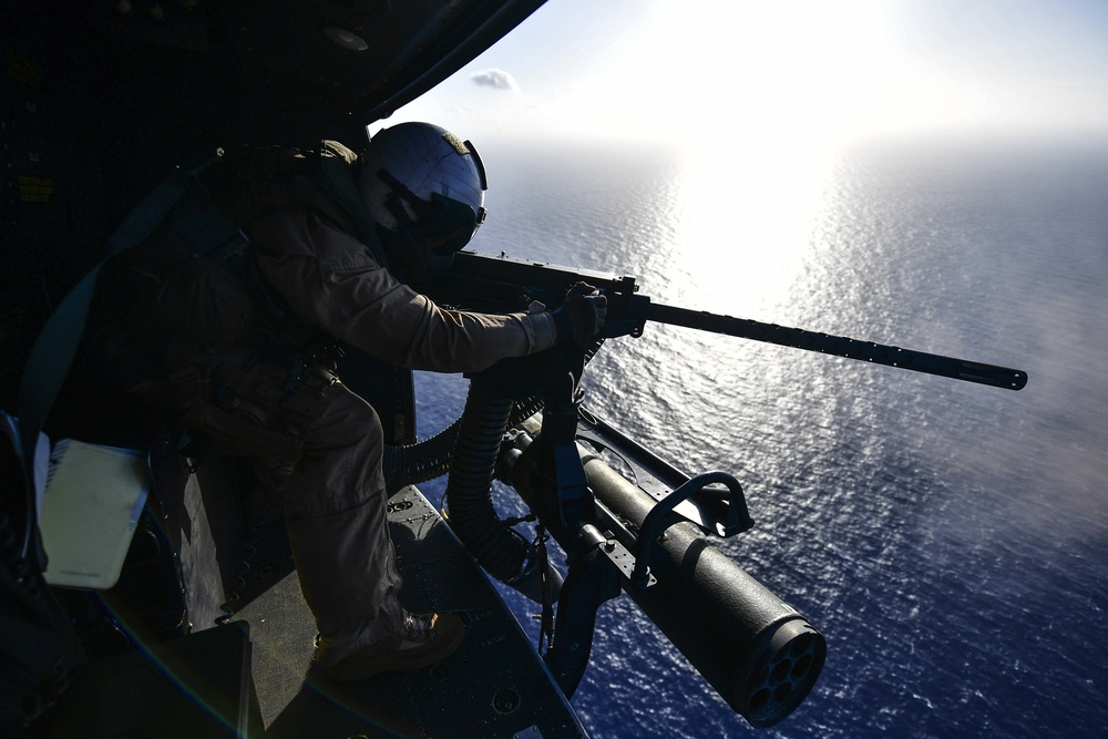 USS San Diego (LPD 22) Crew Chief Shoots .50 Caliber Machine Gun