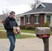 Safety personnel deliver Halloween treat bags to Fort McCoy families