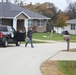 Safety personnel deliver Halloween treat bags to Fort McCoy families