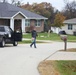 Safety personnel deliver Halloween treat bags to Fort McCoy families