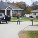 Safety personnel deliver Halloween treat bags to Fort McCoy families