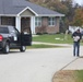 Safety personnel deliver Halloween treat bags to Fort McCoy families