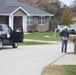 Safety personnel deliver Halloween treat bags to Fort McCoy families