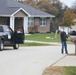 Safety personnel deliver Halloween treat bags to Fort McCoy families