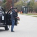 Safety personnel deliver Halloween treat bags to Fort McCoy families