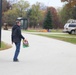 Safety personnel deliver Halloween treat bags to Fort McCoy families