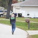 Safety personnel deliver Halloween treat bags to Fort McCoy families