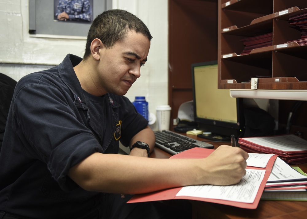 Sailor Processes Paperwork