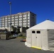 Medical Tent Sits in Front of Hospital