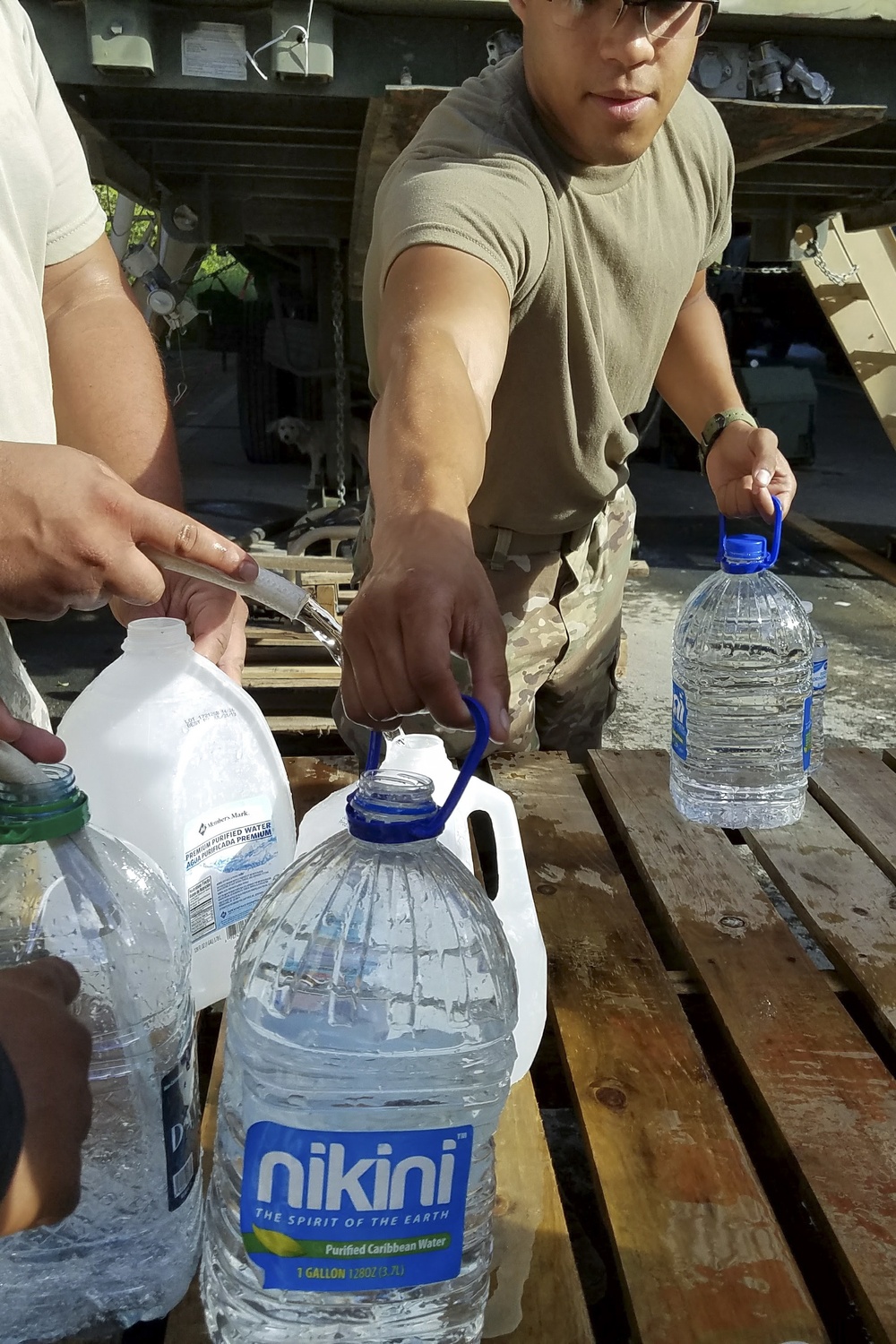 Soldier Handles Water Jugs