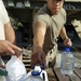 Soldier Handles Water Jugs