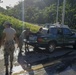 Soldiers Load Water Jugs