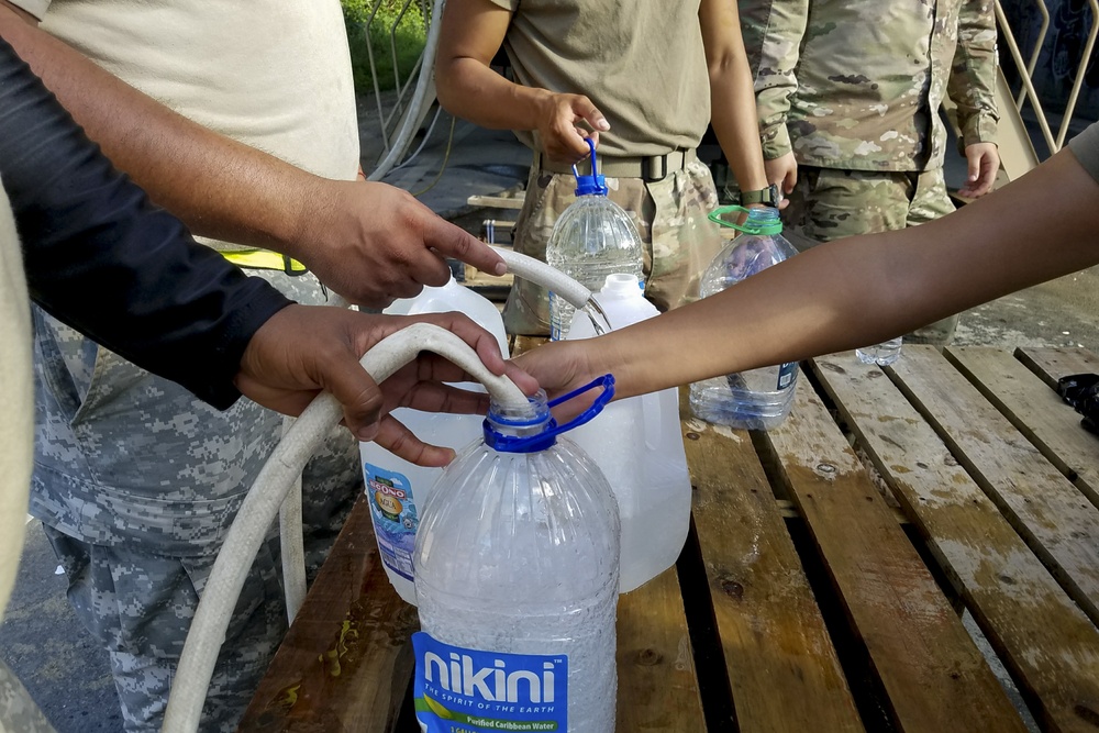 Soldiers Fill Water Jugs