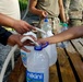 Soldiers Fill Water Jugs