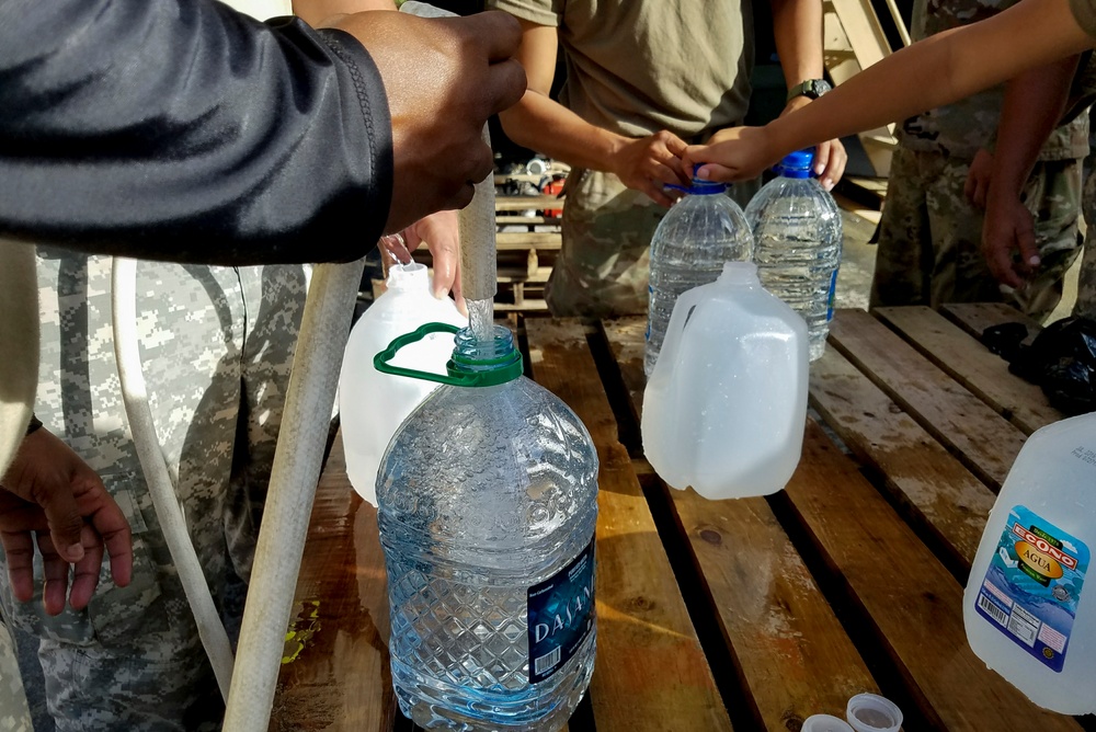 Soldiers Fill Water Jugs