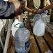 Soldiers Fill Water Jugs