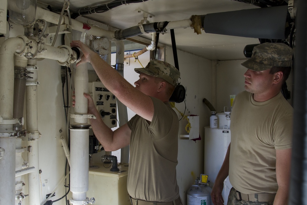 Soldiers Remove ROWPU Filter