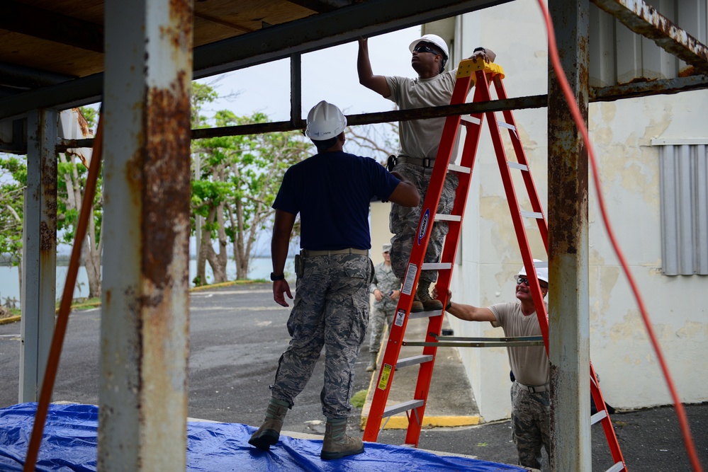 Civil Engineering Airmen repair a fuel shelter