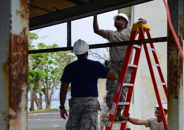 Civil Engineering Airmen repair a fuel shelter