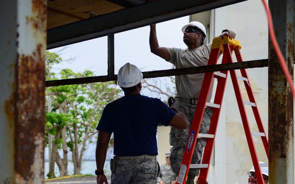Civil Engineering Airmen repair a fuel shelter