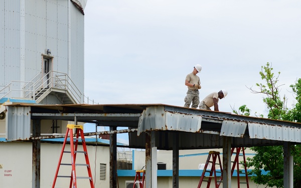Civil Engineering Airmen repair a fuel shelter